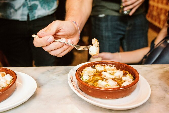 Private Seville Tapas & History Tour - Bar Bistec since 1932: garlic shrimp, home-cooked finish, and your choice of beer or wine