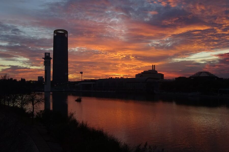 Seville: 2.5-Hour Evening Electric Bike Tour - The Bridge of Triana illumination and the two-perspective city view