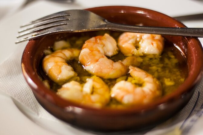 Seville Food Tour: Vermut, Churros & 10+ Tasty Local Dishes - Real-world guide styles you could encounter