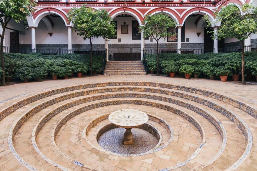 Seville: Hospital de los Venerables Ticket with Audio Guide - Inside the baroque church: arches, frescoes, and sculpture