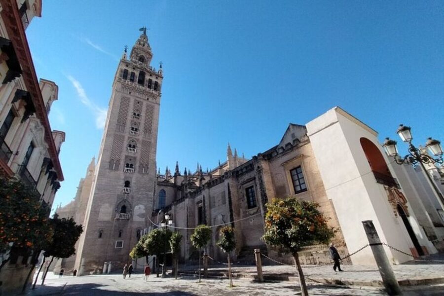 Seville: Private Guided City Walking Tour - Seville Cathedral and the Giralda, how the skyline became a message