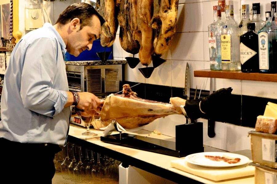 Seville: Wine and Gourmet Tapas Tour - Stop 1: The Local Bodega, Tapas, Drinks, and Dish History